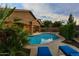 Inviting backyard showcasing a sparkling pool, covered patio, and comfortable lounge seating at 3018 E Vernon St, Gilbert, AZ 85298