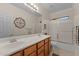 Bathroom with double sinks, a large mirror, and a shower-tub combo at 3018 E Vernon St, Gilbert, AZ 85298
