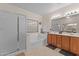 Bathroom featuring a shower, soaking tub, double sink vanity, and natural light at 3018 E Vernon St, Gilbert, AZ 85298