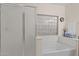Bathroom showcasing a shower, soaking tub, and a privacy window at 3018 E Vernon St, Gilbert, AZ 85298