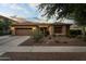 Charming single-story home with a well-manicured desert landscape and a three car garage at 3018 E Vernon St, Gilbert, AZ 85298