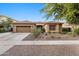 Lovely single-story home with a well-manicured front yard and a convenient two-car garage at 3018 E Vernon St, Gilbert, AZ 85298