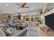 Comfortable living room features a cozy fireplace, view of outdoor swimming pool, and stylish decor at 3018 E Vernon St, Gilbert, AZ 85298