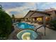 Stunning backyard oasis features a private pool, spa, covered patio, and lush landscaping, perfect for entertaining at 3018 E Vernon St, Gilbert, AZ 85298