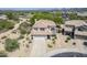 Aerial view of home with tile roof, desert landscaping and mountain views at 31259 N 42Nd Pl, Cave Creek, AZ 85331