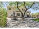 Spacious backyard patio with outdoor dining area shaded by mature tree, perfect for entertaining at 31259 N 42Nd Pl, Cave Creek, AZ 85331