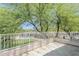 Relaxing outdoor space with white iron railings overlooking lush green yard and sparkling pool at 31259 N 42Nd Pl, Cave Creek, AZ 85331
