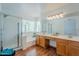 Updated bathroom featuring a glass-enclosed shower, soaking tub, and dual vanities with good natural light at 31259 N 42Nd Pl, Cave Creek, AZ 85331