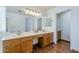 Spacious bathroom with dual sinks, a large mirror, and wood cabinets at 31259 N 42Nd Pl, Cave Creek, AZ 85331