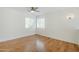 Bright bedroom featuring a ceiling fan and a large window at 31259 N 42Nd Pl, Cave Creek, AZ 85331