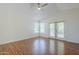 A bright bedroom with vaulted ceiling, ceiling fan, and a door leading to a patio at 31259 N 42Nd Pl, Cave Creek, AZ 85331