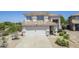 Charming two-story home with a tile roof, desert landscaping, and a spacious two-car garage at 31259 N 42Nd Pl, Cave Creek, AZ 85331