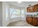 Bright eat-in kitchen area with wood cabinets, granite countertops and multiple windows at 31259 N 42Nd Pl, Cave Creek, AZ 85331