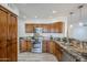 Well-appointed kitchen featuring stainless steel appliances, granite countertops, and custom wood cabinets at 31259 N 42Nd Pl, Cave Creek, AZ 85331