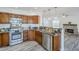 Modern kitchen featuring stainless steel appliances, granite countertops, and open layout to living room at 31259 N 42Nd Pl, Cave Creek, AZ 85331