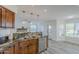 Kitchen sink featuring stainless steel appliances and granite countertops with views of the living room and yard at 31259 N 42Nd Pl, Cave Creek, AZ 85331