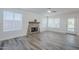 Cozy living room with stone fireplace, neutral paint, and bright natural light at 31259 N 42Nd Pl, Cave Creek, AZ 85331