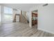 Open-concept living room featuring wood-look tile flooring and a view into the kitchen and entryway at 31259 N 42Nd Pl, Cave Creek, AZ 85331