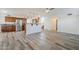 Open floor plan with kitchen and living room areas featuring wood cabinets and stainless steel appliances at 31259 N 42Nd Pl, Cave Creek, AZ 85331