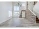 Bright living room with soaring ceilings, a stone fireplace, and abundant natural light at 31259 N 42Nd Pl, Cave Creek, AZ 85331