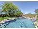 Sparkling pool with rock waterfall, spa and mature landscaping at 31259 N 42Nd Pl, Cave Creek, AZ 85331