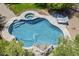 Aerial view of the sparkling pool and spa area with waterfall feature and sun loungers at 31259 N 42Nd Pl, Cave Creek, AZ 85331