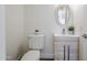 Cozy powder room featuring a modern sink and vanity with gray wood-look cabinets at 31259 N 42Nd Pl, Cave Creek, AZ 85331