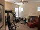 Home gym featuring exercise equipment and a ceiling fan at 35401 N Via Tramonto St, Phoenix, AZ 85086