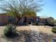 Inviting single-Gathering home showcasing desert landscaping, a paved walkway, and a decorative front door at 35401 N Via Tramonto St, Phoenix, AZ 85086