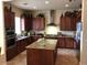 Well-equipped kitchen with granite countertops, stainless steel appliances, and ample cabinet space at 35401 N Via Tramonto St, Phoenix, AZ 85086