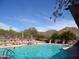 Resort-style pool surrounded by lush landscaping and mountain views, ideal for relaxation and recreation at 35401 N Via Tramonto St, Phoenix, AZ 85086