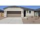 Charming single-story home showcasing a well-manicured yard and neutral color palette at 35512 N Common Ct, San Tan Valley, AZ 85140