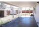 A covered back patio, enclosed by a decorative metal fence and offering a view of the backyard, providing a shady outdoor space at 3651 W Mariposa St, Phoenix, AZ 85019
