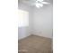 Standard bedroom with tiled flooring, a ceiling fan, and a window at 3651 W Mariposa St, Phoenix, AZ 85019