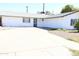 Charming single-story home featuring a well-maintained white exterior and spacious driveway at 3651 W Mariposa St, Phoenix, AZ 85019