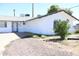 Well-kept single-Gathering home with a white exterior, tidy yard and two-car garage at 3651 W Mariposa St, Phoenix, AZ 85019