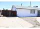 Single story home featuring a gray roof, gated front door, and a spacious driveway at 3651 W Mariposa St, Phoenix, AZ 85019