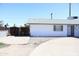 Charming single-story home with a gray roof, a gated front door, and a spacious driveway at 3651 W Mariposa St, Phoenix, AZ 85019
