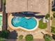 Aerial view of a private pool, patio, and well-manicured landscaping in the backyard at 4440 E Tether Trl, Phoenix, AZ 85050