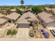 Expansive aerial view of a single-Gathering home showcasing its desert landscape and the surrounding neighborhood at 4440 E Tether Trl, Phoenix, AZ 85050