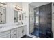 Renovated bathroom with double sink vanity, tiled shower, and modern fixtures at 4440 E Tether Trl, Phoenix, AZ 85050