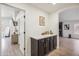 Transitional space with modern cabinetry and decor, connecting to the main living area and bedroom at 4440 E Tether Trl, Phoenix, AZ 85050