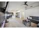 Open-concept layout featuring a modern kitchen, dining area, and living room with light wood floors at 4440 E Tether Trl, Phoenix, AZ 85050