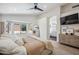 Well-lit main bedroom showcasing a stylish ensuite bathroom and large windows with outside views at 4440 E Tether Trl, Phoenix, AZ 85050