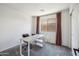Office features a modern desk, comfortable chair, neutral carpet, and bright natural light at 4440 E Tether Trl, Phoenix, AZ 85050