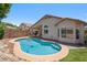Private pool with poolside landscaping and serene backyard, creating a refreshing outdoor space at 4440 E Tether Trl, Phoenix, AZ 85050