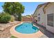 Beautiful pool and lush landscaping offer a relaxing outdoor space for leisure and entertainment at 4440 E Tether Trl, Phoenix, AZ 85050