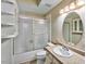 Bathroom featuring a tub and shower combination with glass door and updated vanity with mirror at 5640 E Bell Rd # 1034, Scottsdale, AZ 85254