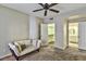 This bedroom has a ceiling fan, neutral walls and carpet, and a walk-in closet at 5640 E Bell Rd # 1034, Scottsdale, AZ 85254