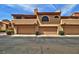 Well-maintained home exterior with private garages and meticulous landscaping at 5640 E Bell Rd # 1034, Scottsdale, AZ 85254